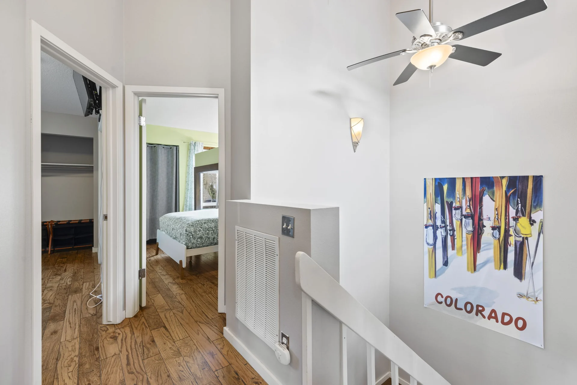 Trailside Retreat, Upper landing with ceiling fan and Colorado wall art, luxury vacation rental in Silverthorne, Colorado