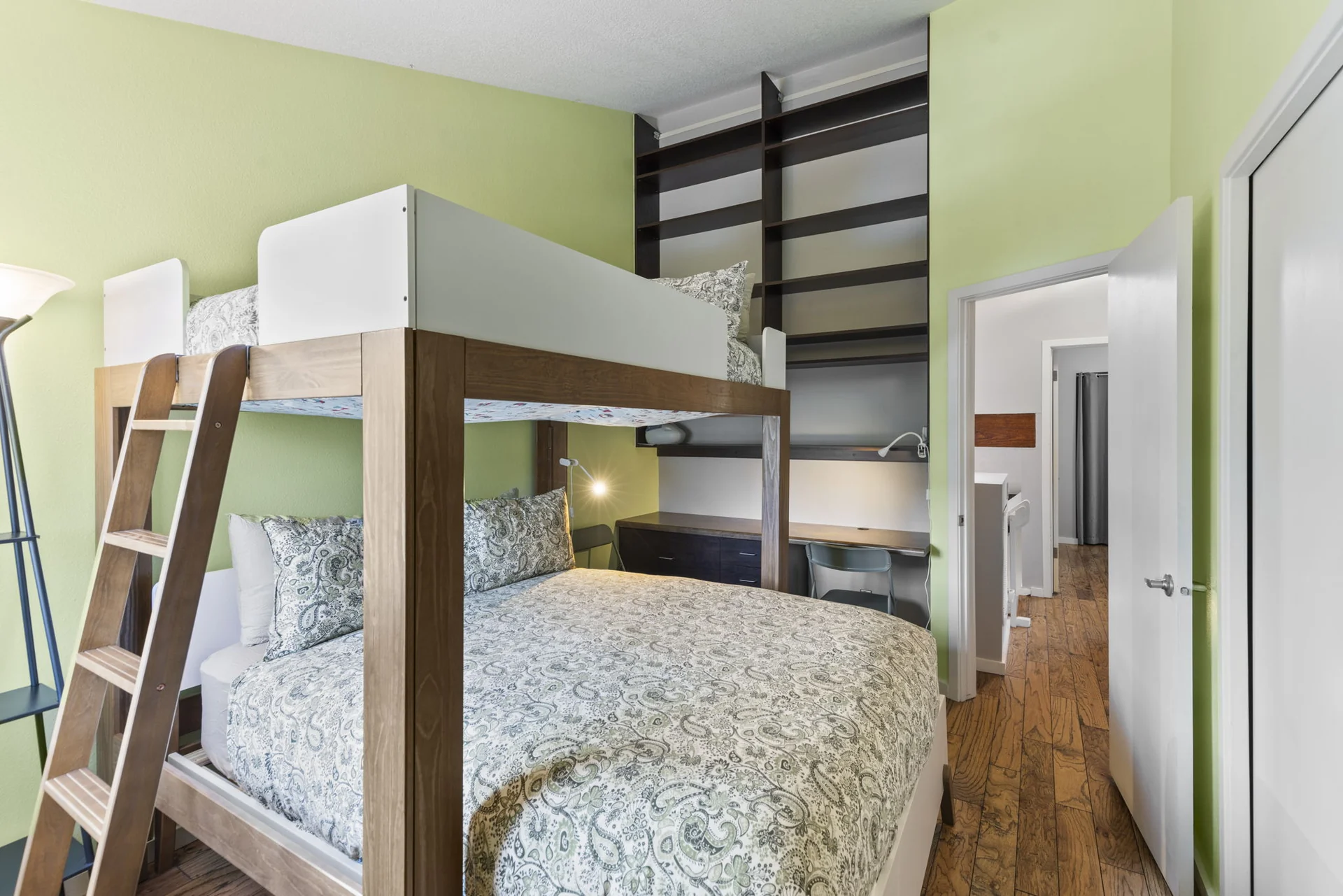 Trailside Retreat, Lofted bed and queen mattress in green bedroom with ladder and desk, luxury vacation rental in Silverthorne, Colorado