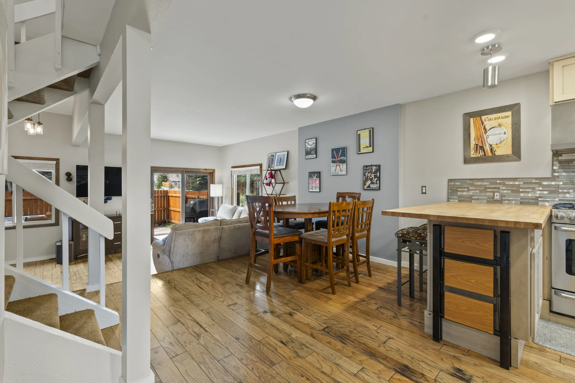 Trailside Retreat, Dining table between the kitchen island and living room, luxury vacation rental in Silverthorne, Colorado