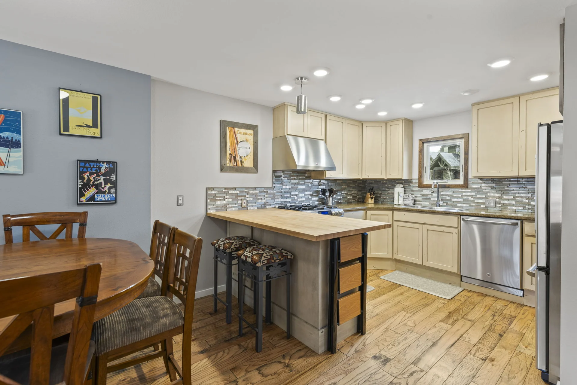 Trailside Retreat, Kitchen island and appliances beside the dining table, luxury vacation rental in Silverthorne, Colorado