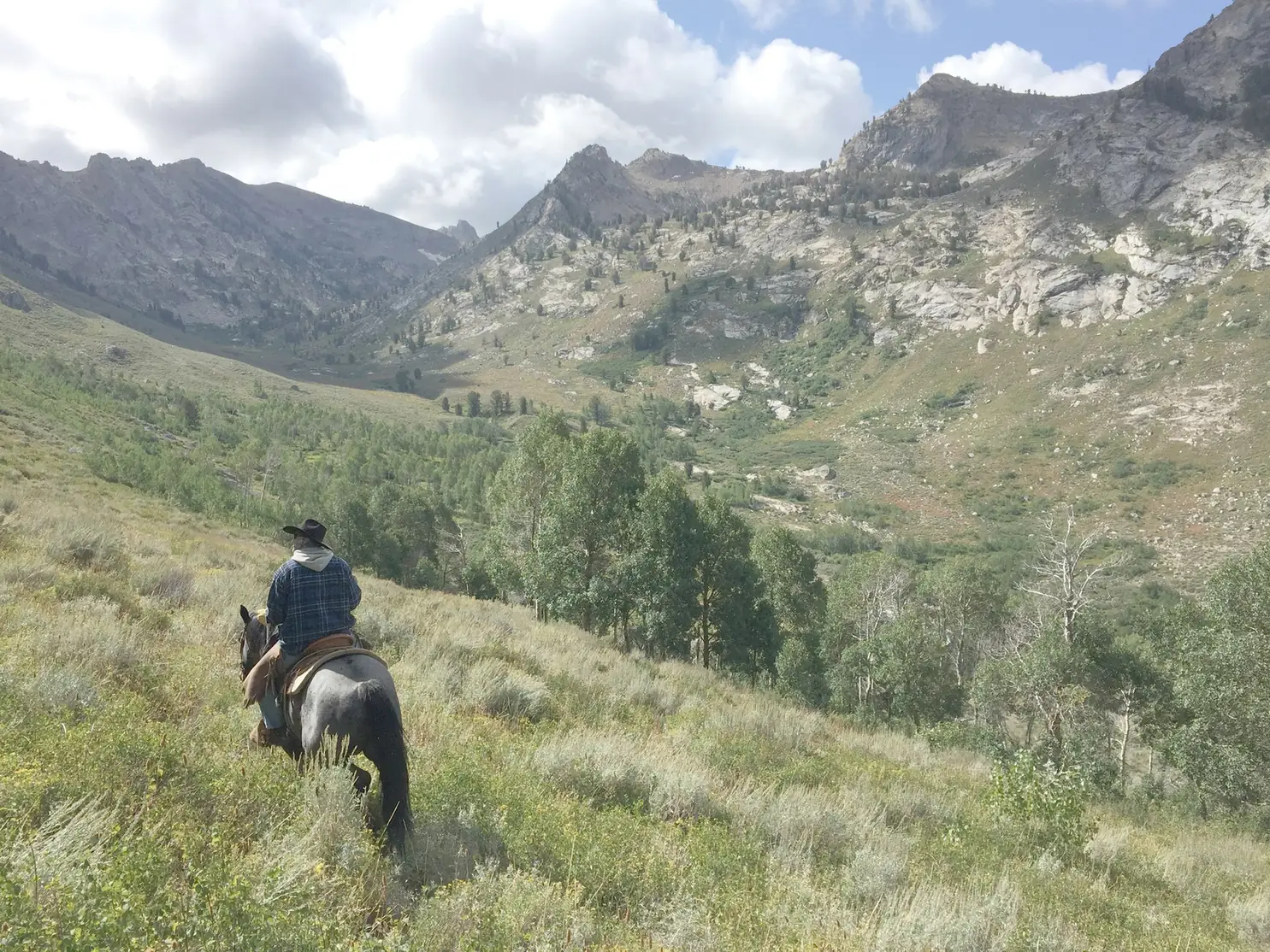Trailside Retreat, Horseback rider on an alpine mountain trail near the retreat, luxury vacation rental in Silverthorne, Colorado