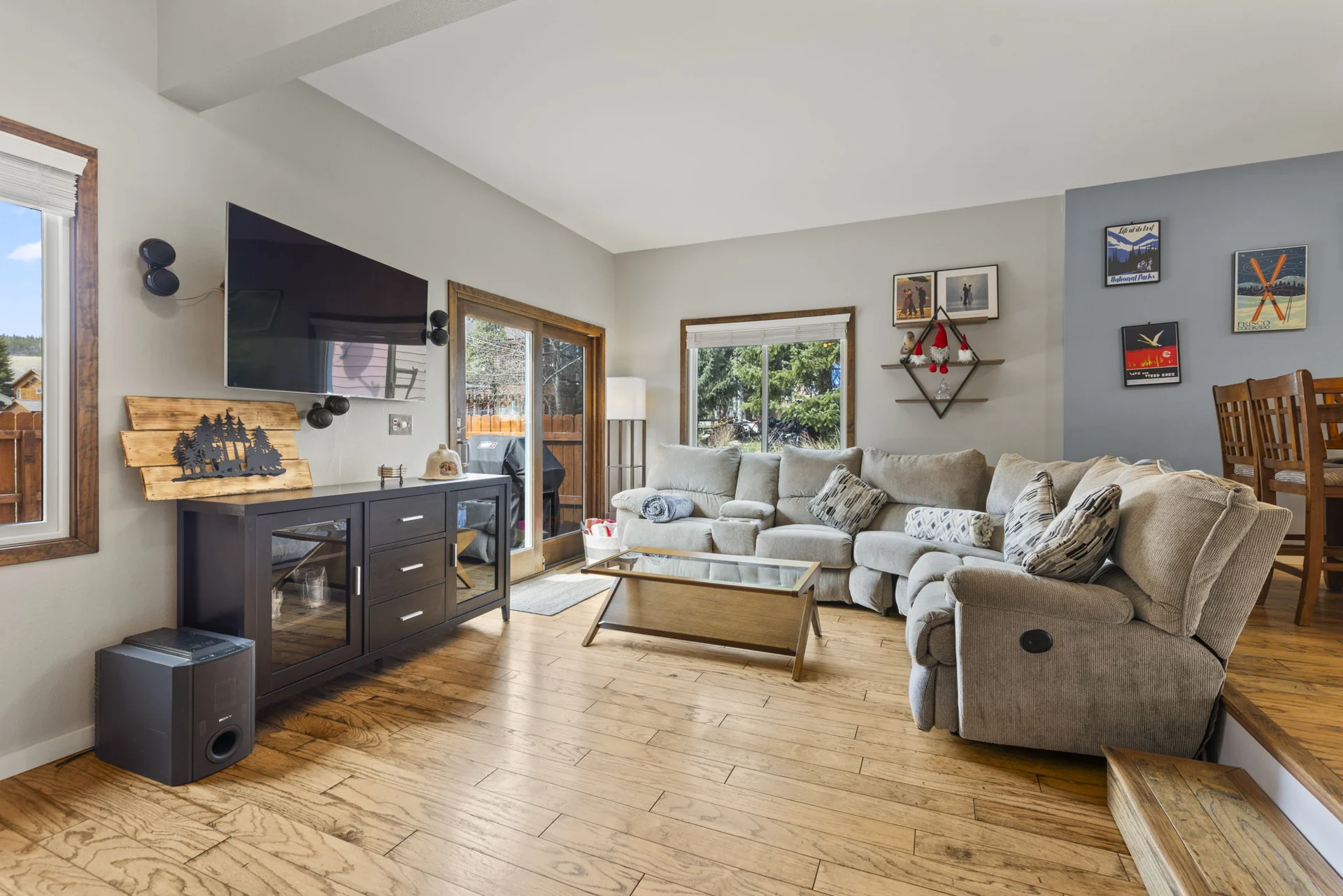 Trailside Retreat, Sectional sofa, recliner, glass coffee table, and television, luxury vacation rental in Silverthorne, Colorado